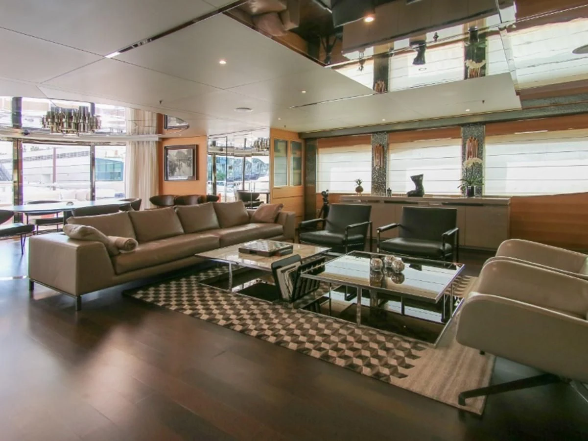 a living room with a couch and a table aboard DARLING Yacht for Sale