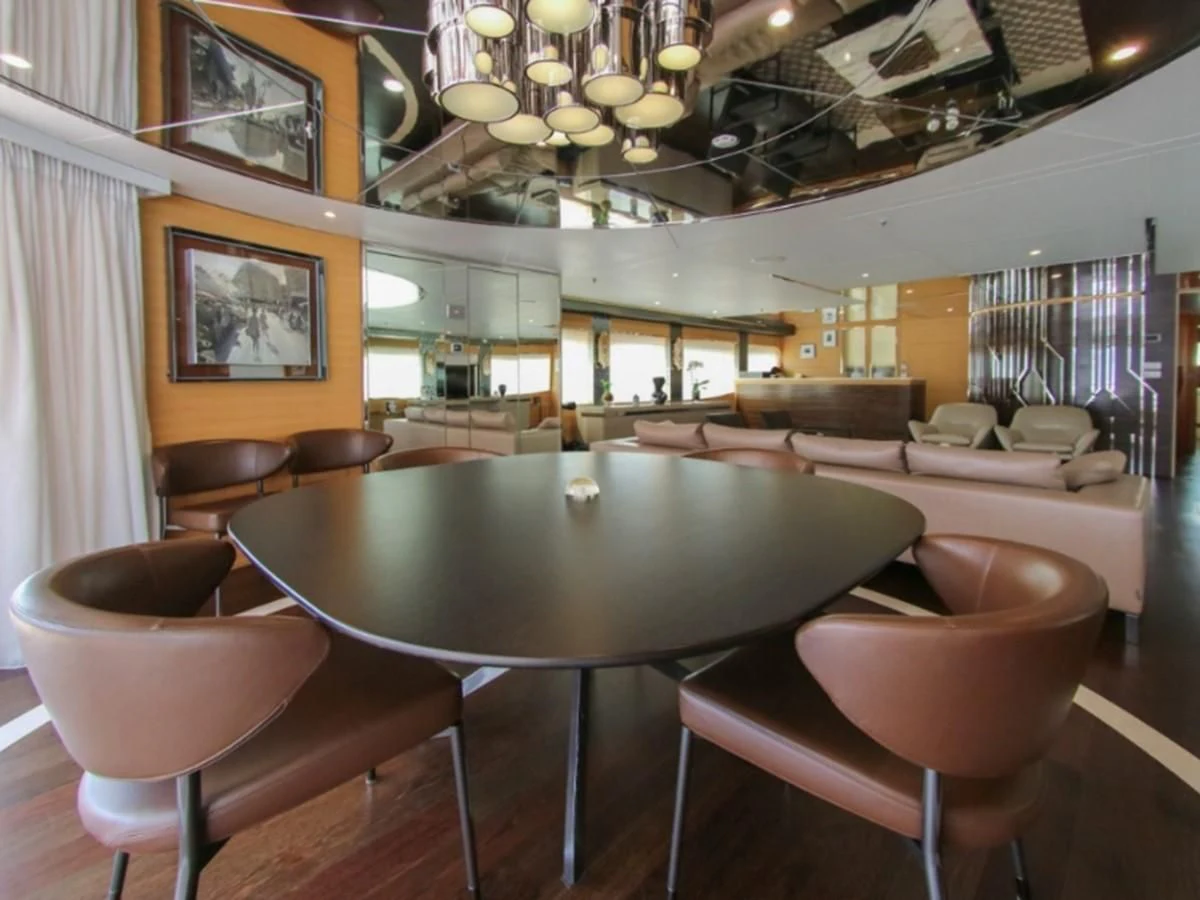 a dining room with a table and chairs aboard DARLING Yacht for Sale