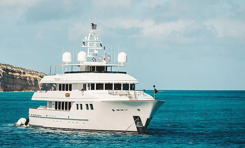 a large white boat in the water aboard INGOT Yacht for Sale