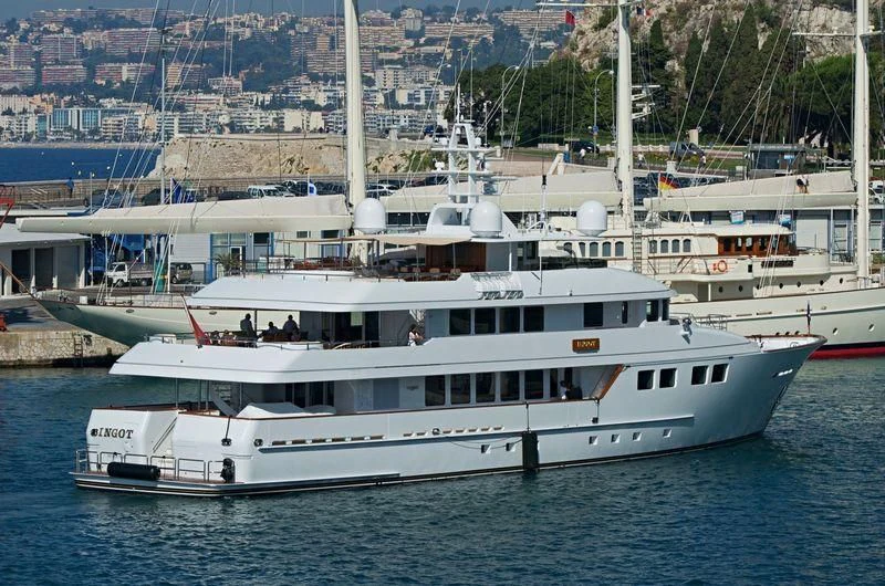 a large white boat in the water aboard INGOT Yacht for Sale