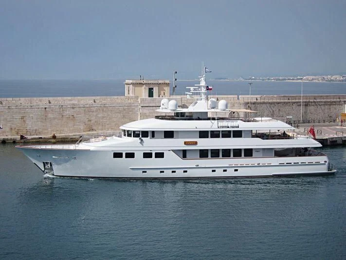 a large white boat in the water aboard INGOT Yacht for Sale