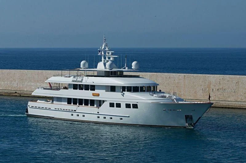 a large white boat in the water aboard INGOT Yacht for Sale