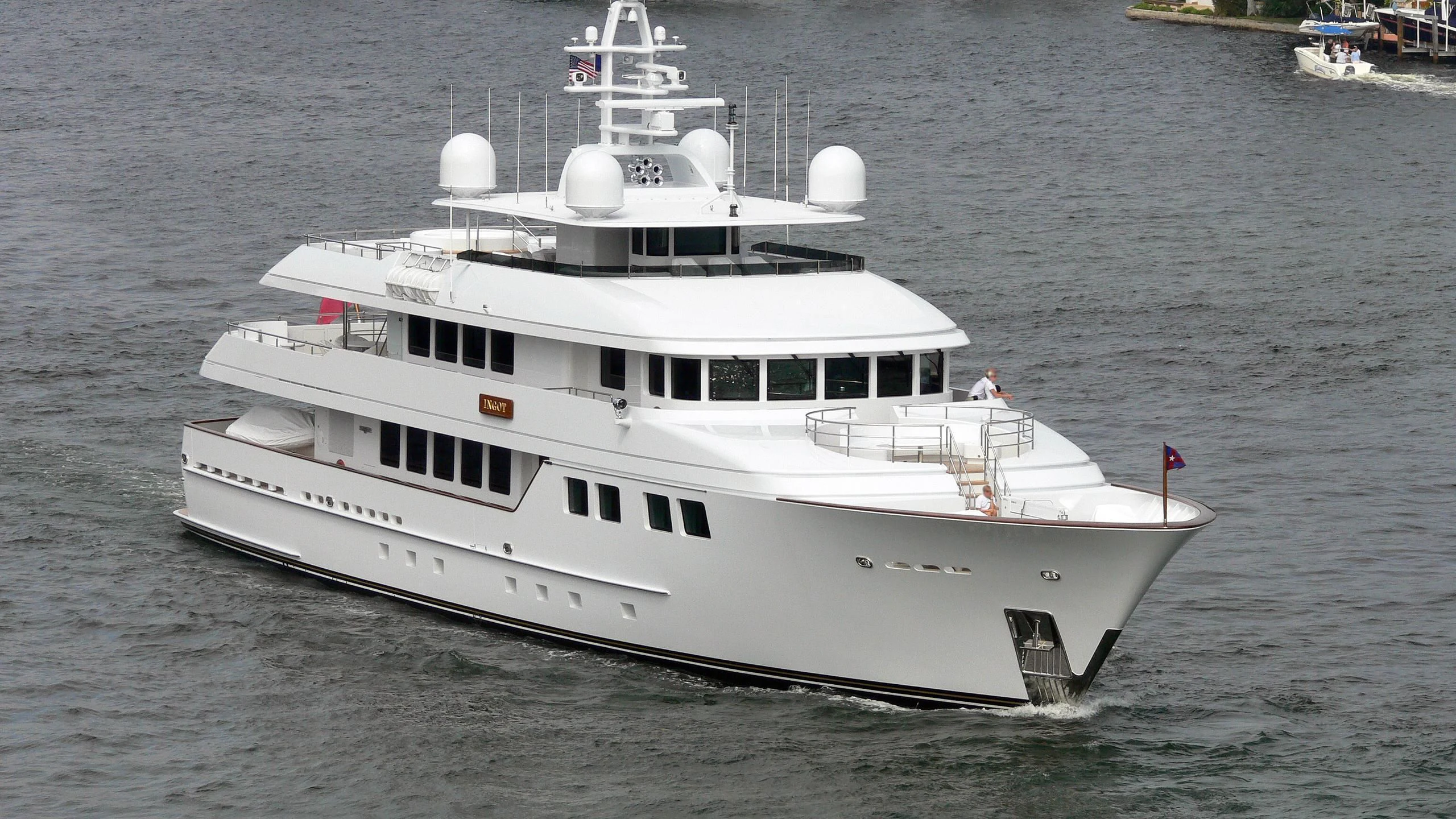 a white boat on the water aboard INGOT Yacht for Sale