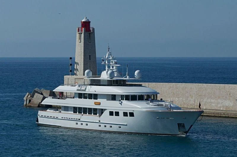 a large white boat in the water aboard INGOT Yacht for Sale