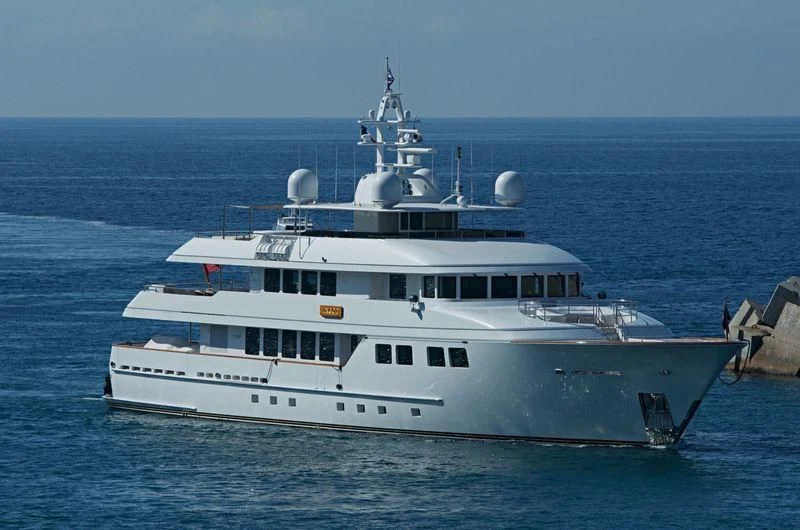 a large white boat in the water aboard INGOT Yacht for Sale