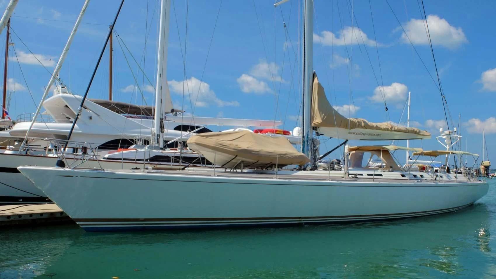 a white yacht in the water aboard DEIANEIRA Yacht for Sale