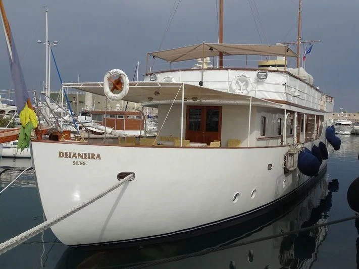 a white boat in the water aboard DEIANEIRA Yacht for Sale