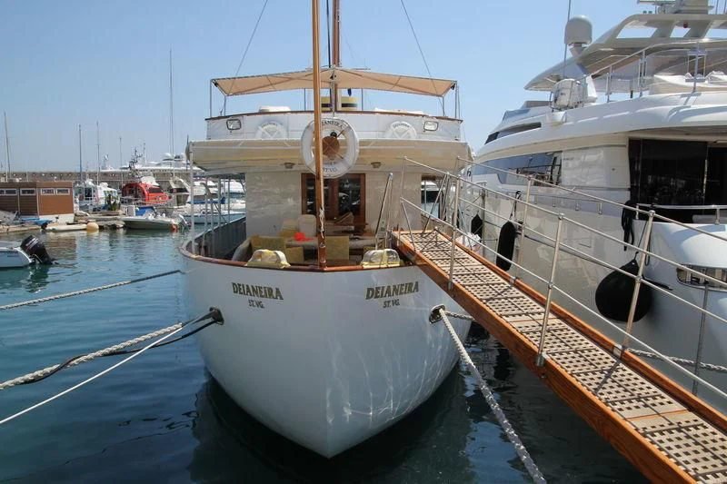 a boat tied to a dock aboard DEIANEIRA Yacht for Sale