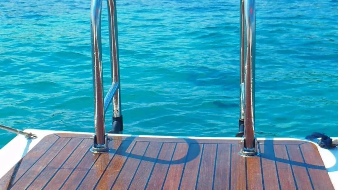 a wooden dock over a body of water aboard DEIANEIRA Yacht for Sale