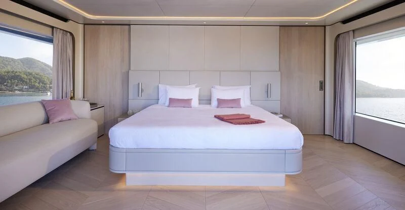 a room with a bed and a window aboard LL Yacht for Sale