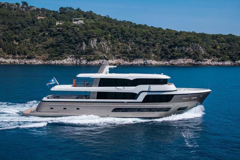 a white yacht on the water aboard LL Yacht for Sale