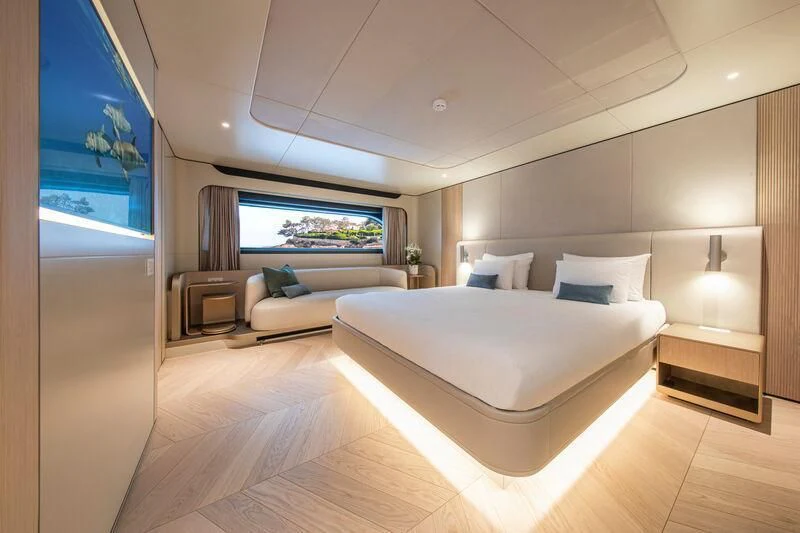 a room with a bed and a couch aboard LL Yacht for Sale