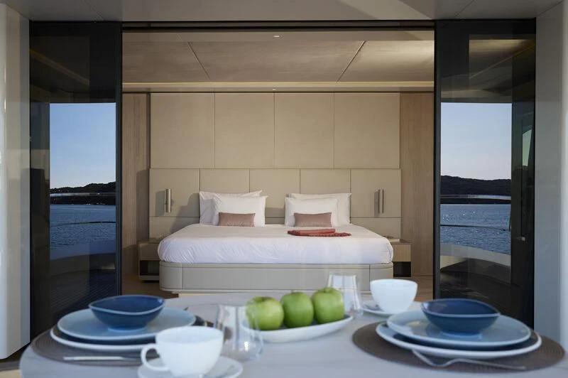 a table with plates and cups on it aboard LL Yacht for Sale