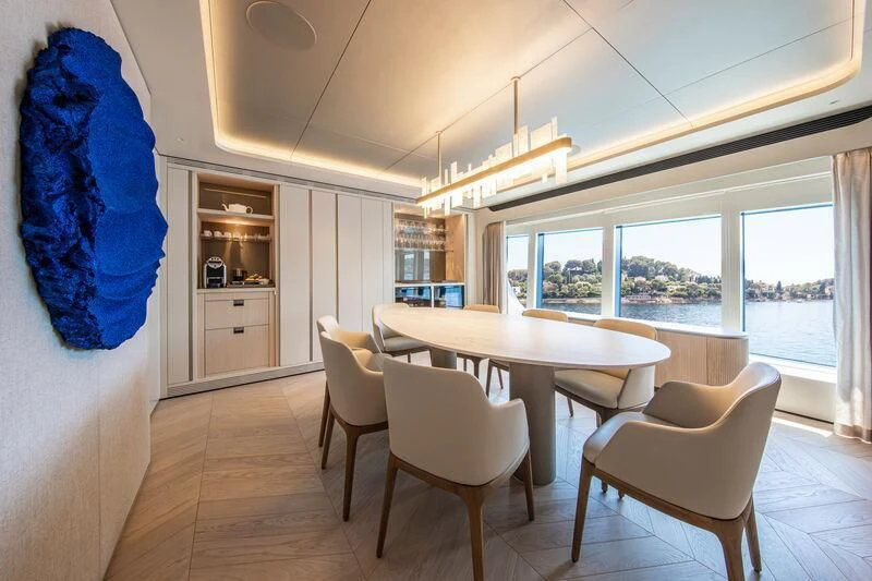 a kitchen with a table and chairs aboard LL Yacht for Sale