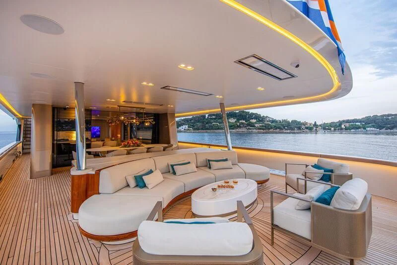 a large living room with a large balcony aboard LL Yacht for Sale