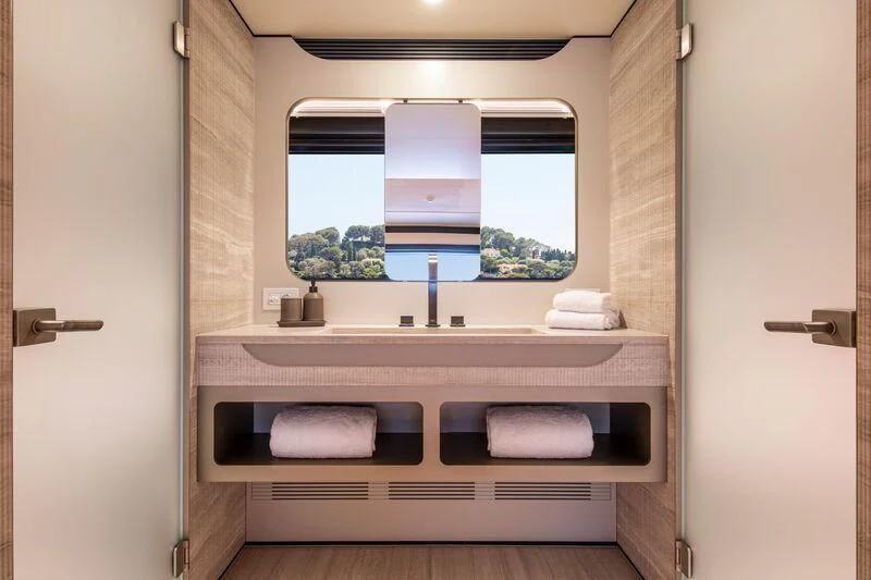 a bathroom with a large window aboard LL Yacht for Sale