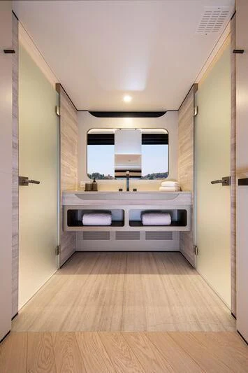 a bathroom with a large window aboard LL Yacht for Sale