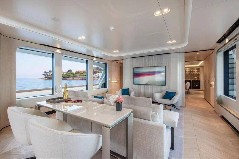 a living room with a large window aboard LL Yacht for Sale