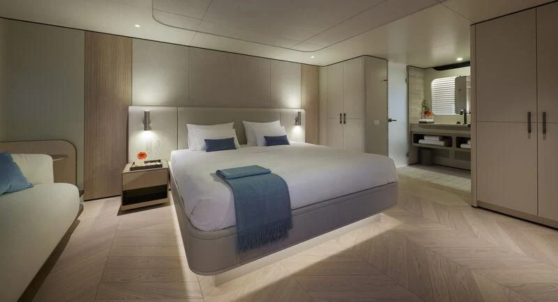 a large bedroom with a bed aboard LL Yacht for Sale