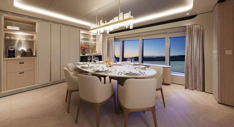 a kitchen with a table and chairs aboard LL Yacht for Sale