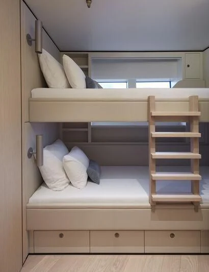 a bed with white sheets aboard LL Yacht for Sale