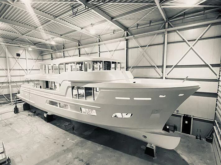a large military jet in a hangar aboard LL Yacht for Sale