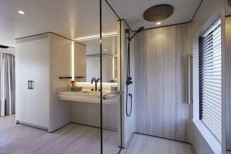 a bathroom with a sink and a mirror aboard LL Yacht for Sale