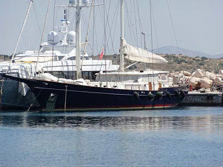 a boat with a flag on it aboard SIX PLUS TWO Yacht for Sale