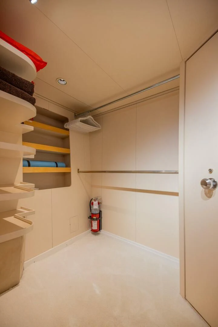 a white tiled staircase aboard ENTOURAGE Yacht for Sale