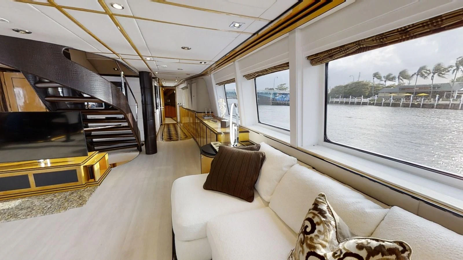 a large living room with a large window aboard ENTOURAGE Yacht for Sale