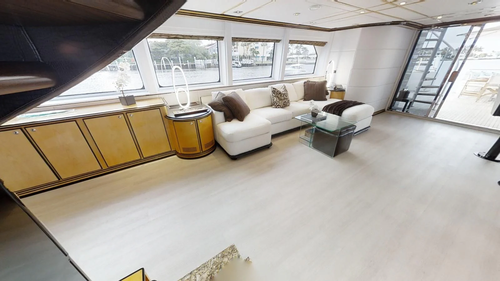 a living room with a large window aboard ENTOURAGE Yacht for Sale