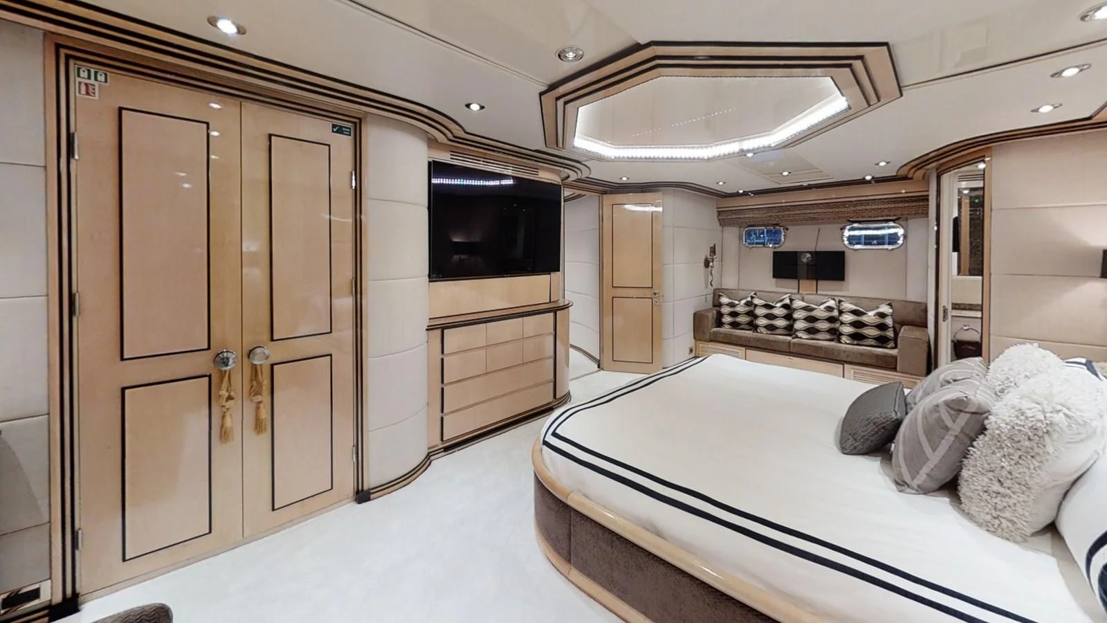 a room with a bed and a tv aboard ENTOURAGE Yacht for Sale