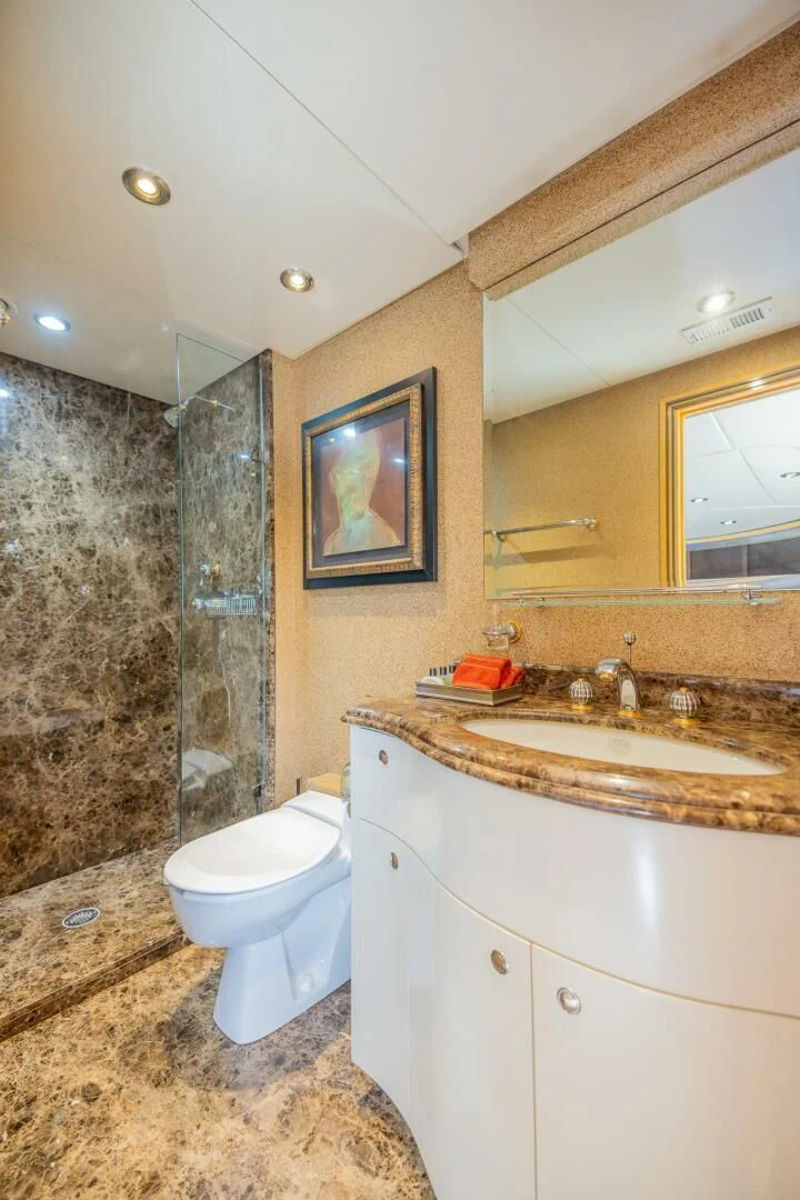 a bathroom with a marble counter top aboard ENTOURAGE Yacht for Sale
