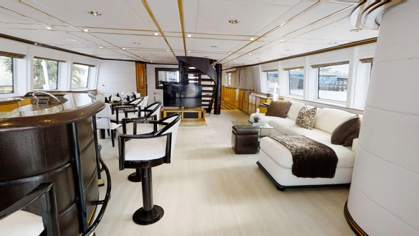 a living room with a couch and a table aboard ENTOURAGE Yacht for Sale