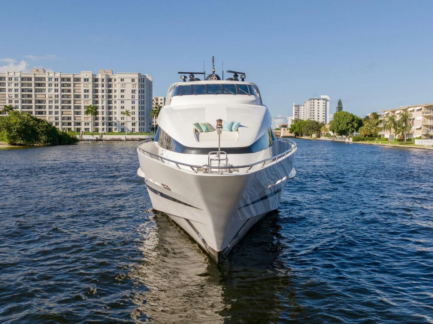 a large white boat on the water aboard ENTOURAGE Yacht for Sale