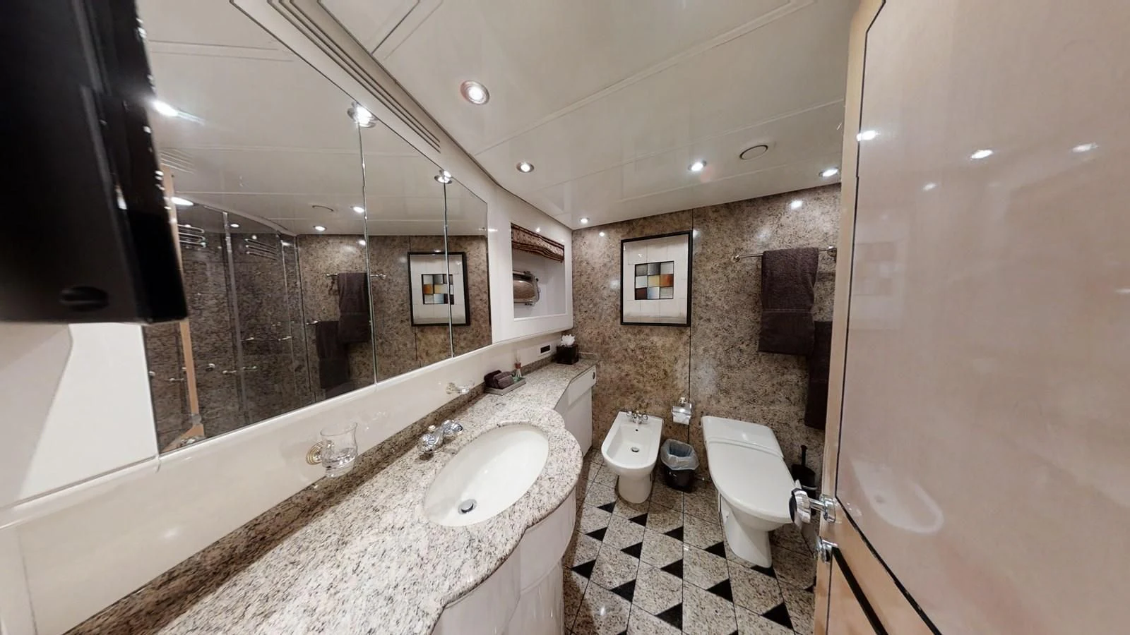 a bathroom with a large mirror aboard ENTOURAGE Yacht for Sale