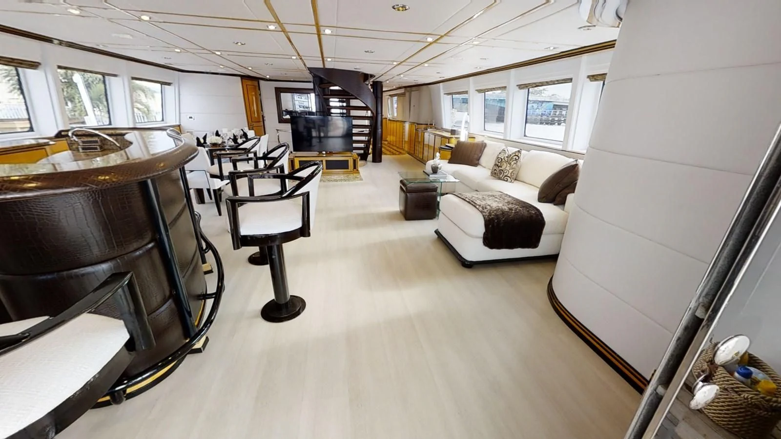 a living room with a couch and a piano aboard ENTOURAGE Yacht for Sale