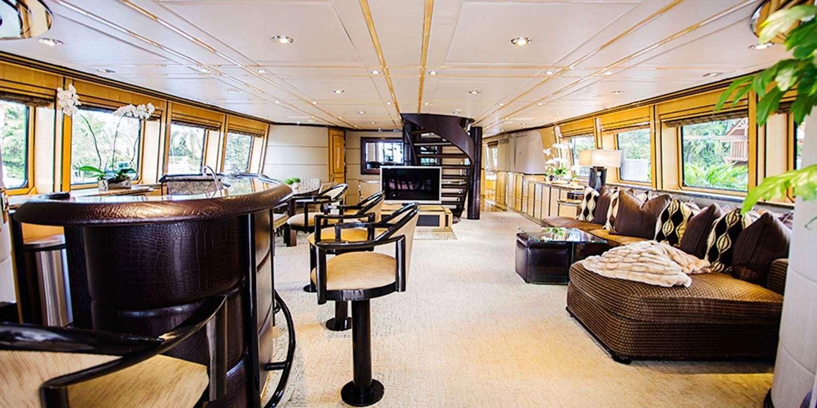 a living room with a couch and a table aboard ENTOURAGE Yacht for Sale