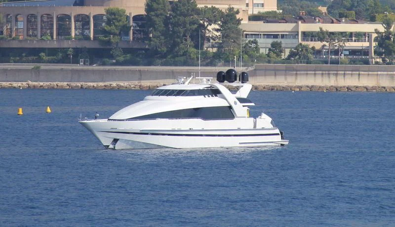 a white boat on the water aboard ENTOURAGE Yacht for Sale