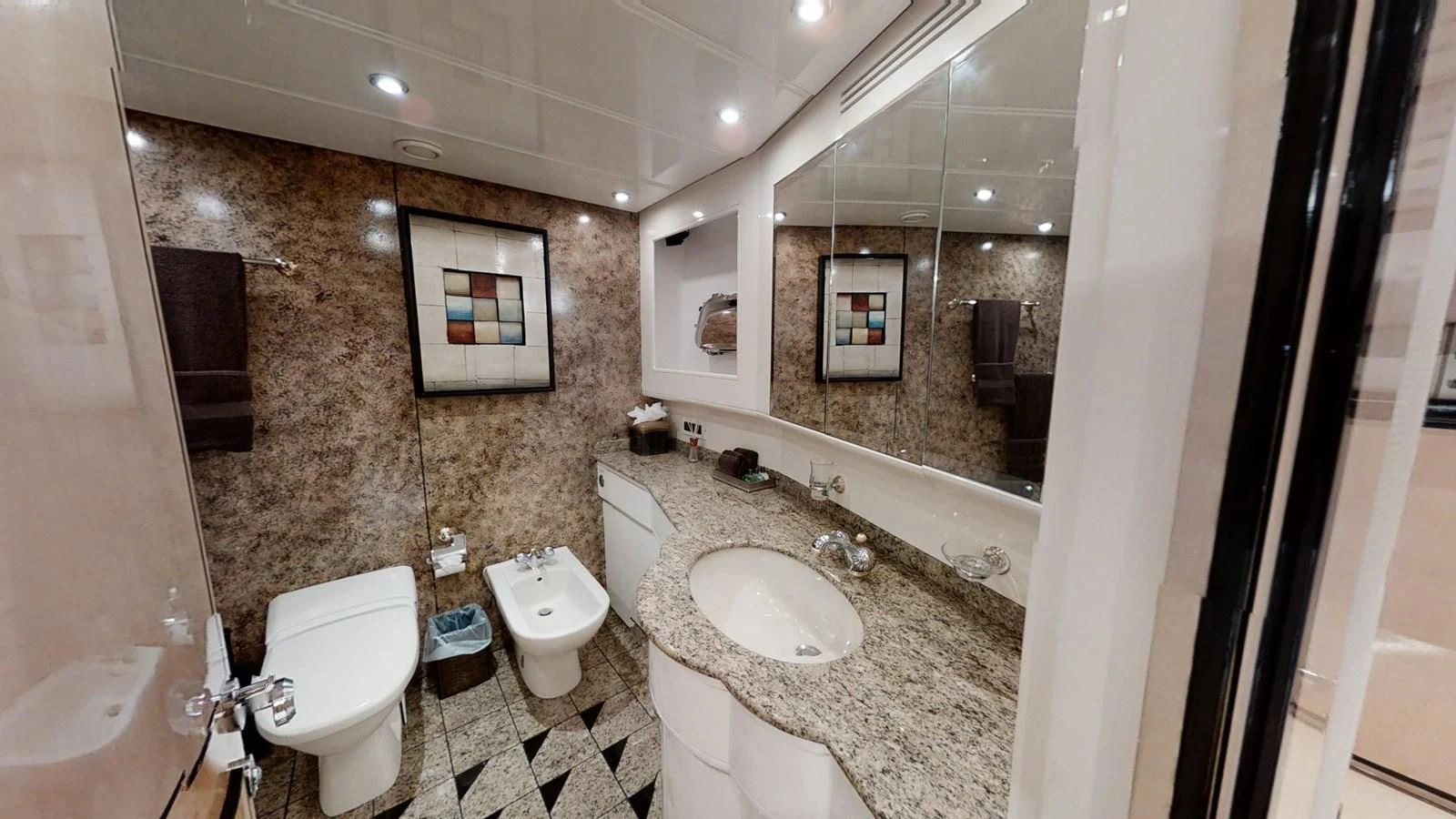 a bathroom with a marble counter top aboard ENTOURAGE Yacht for Sale