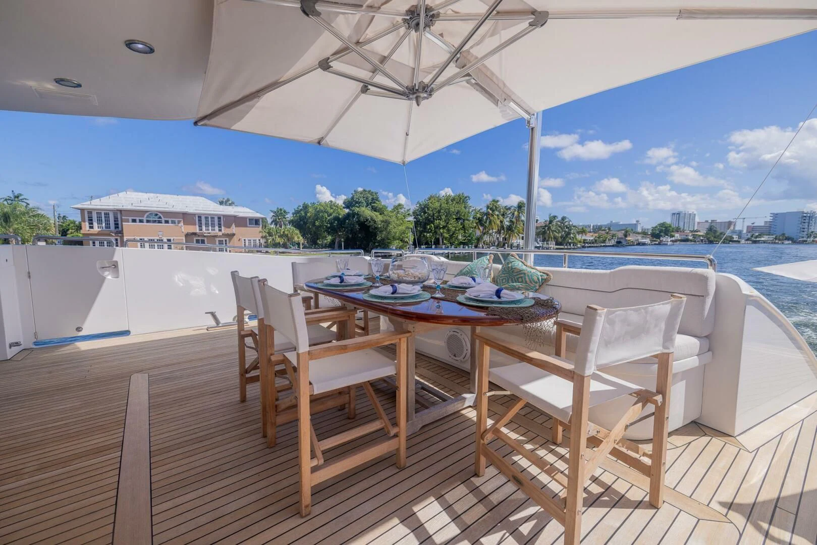 a table and chairs on a patio aboard ENTOURAGE Yacht for Sale