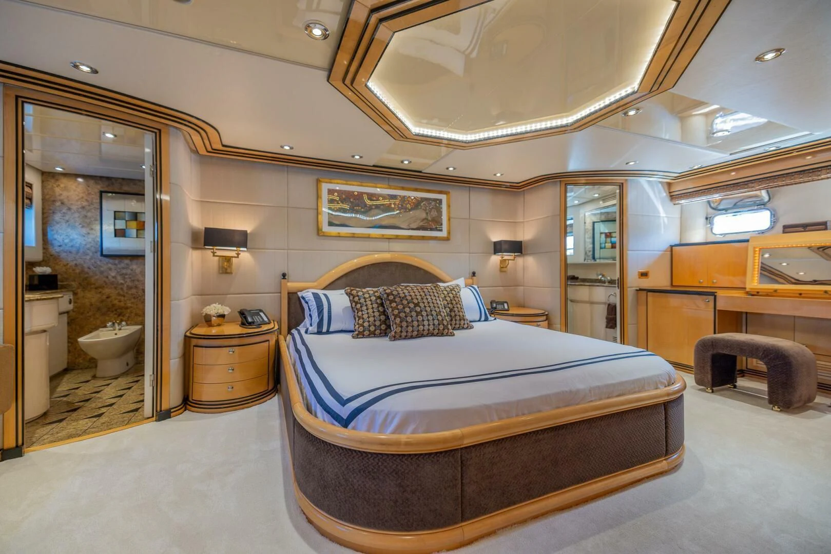 a large bedroom with a bed aboard ENTOURAGE Yacht for Sale