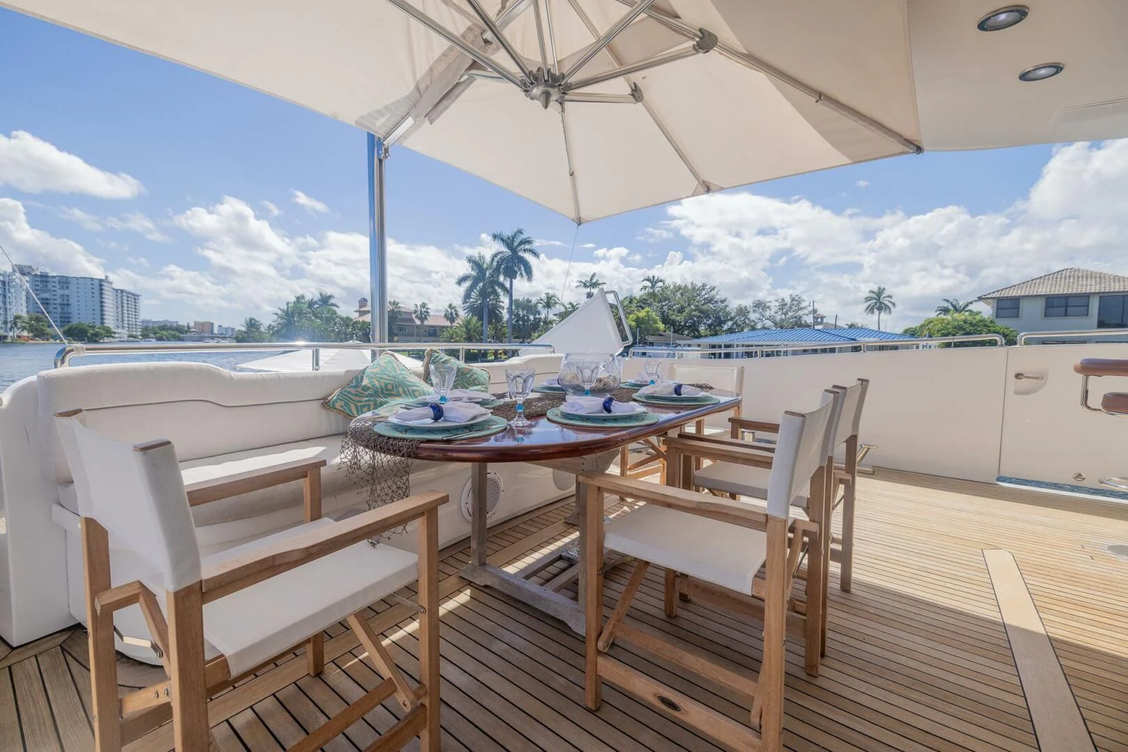 a table and chairs on a deck aboard ENTOURAGE Yacht for Sale