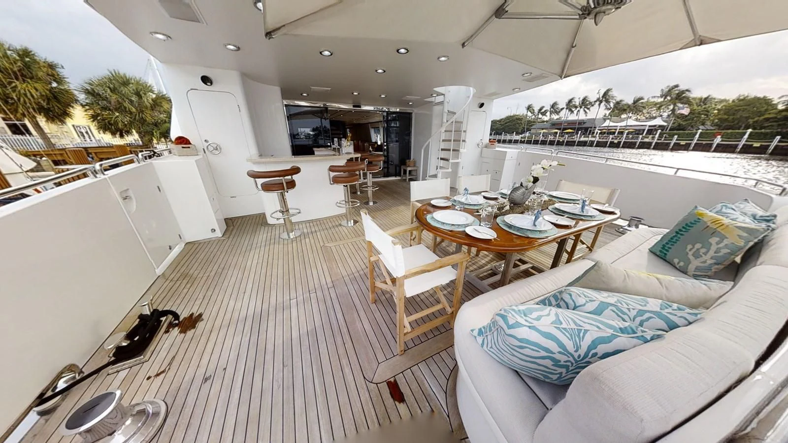a room with a table chairs and a couch aboard ENTOURAGE Yacht for Sale