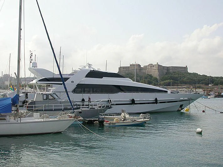 a boat docked at a pier aboard ENTOURAGE Yacht for Sale