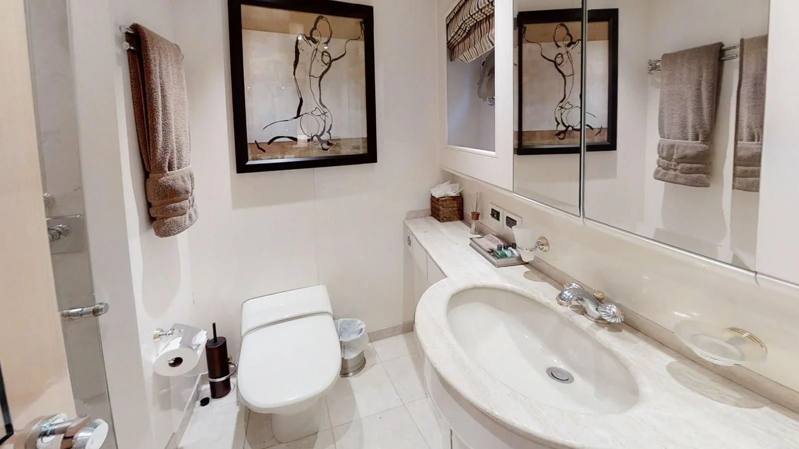 a bathroom with a toilet and sink aboard ENTOURAGE Yacht for Sale