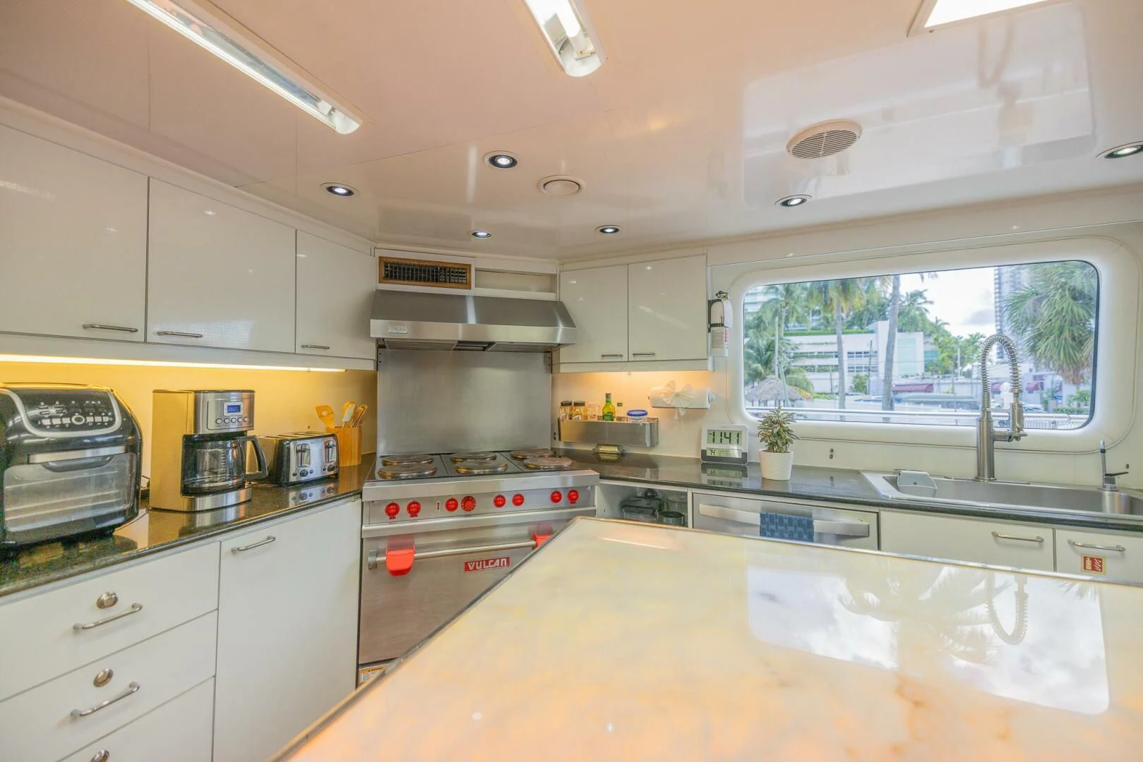 a kitchen with a stove and oven aboard ENTOURAGE Yacht for Sale