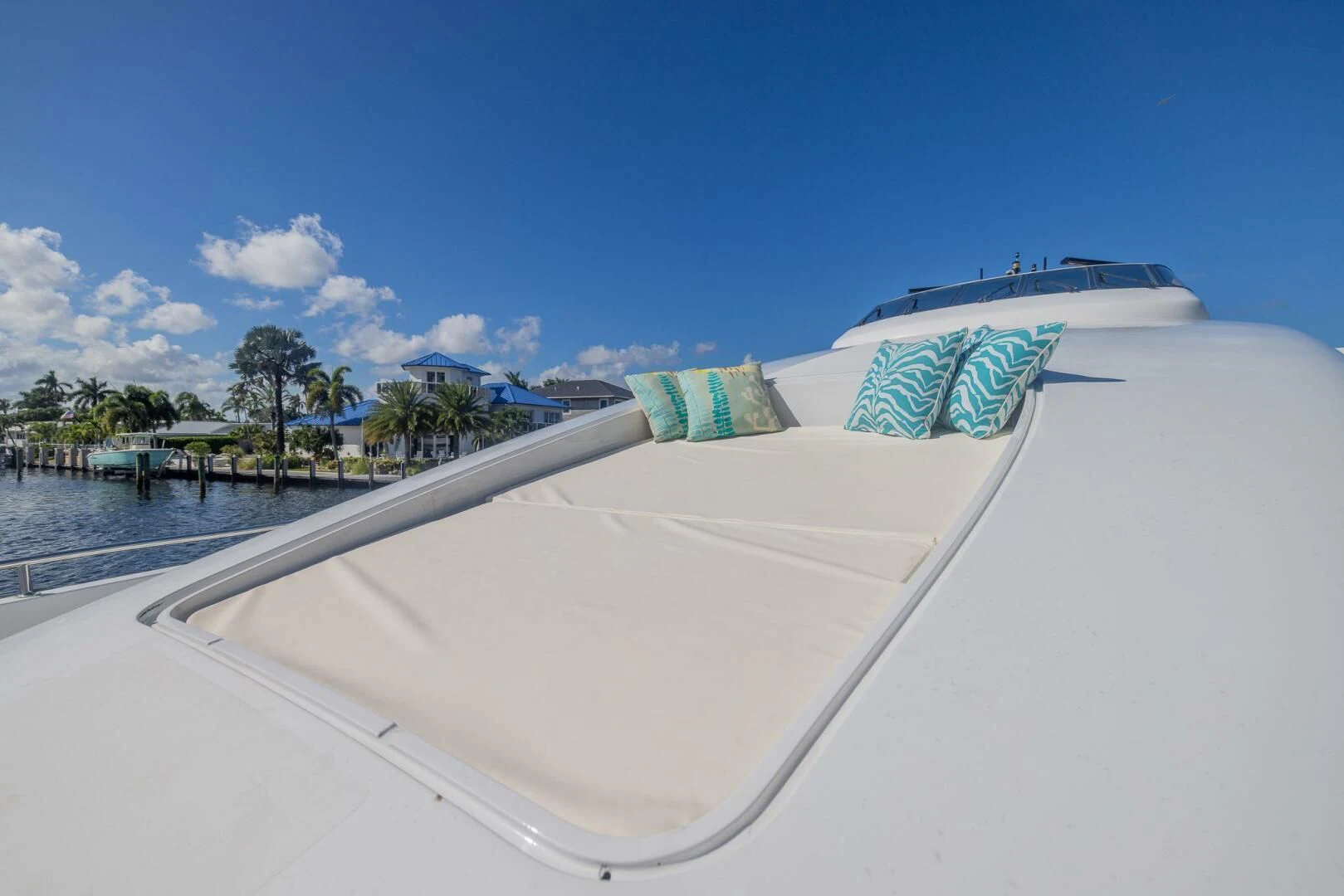 a white building with blue and green designs on it aboard ENTOURAGE Yacht for Sale
