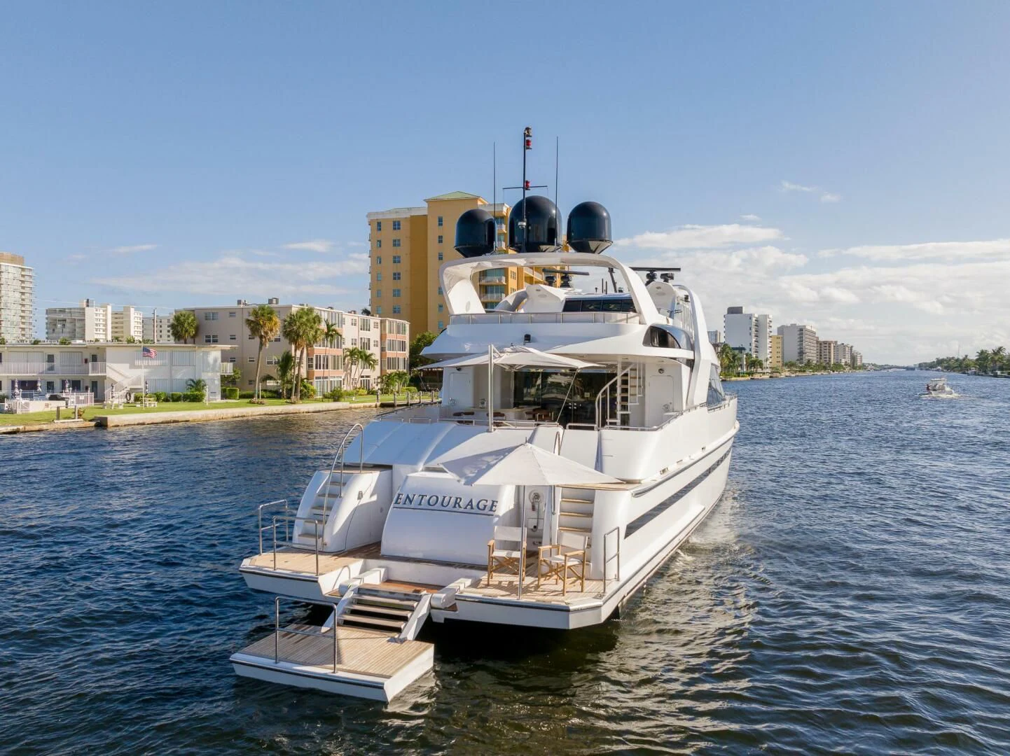 a large white boat on the water aboard ENTOURAGE Yacht for Sale