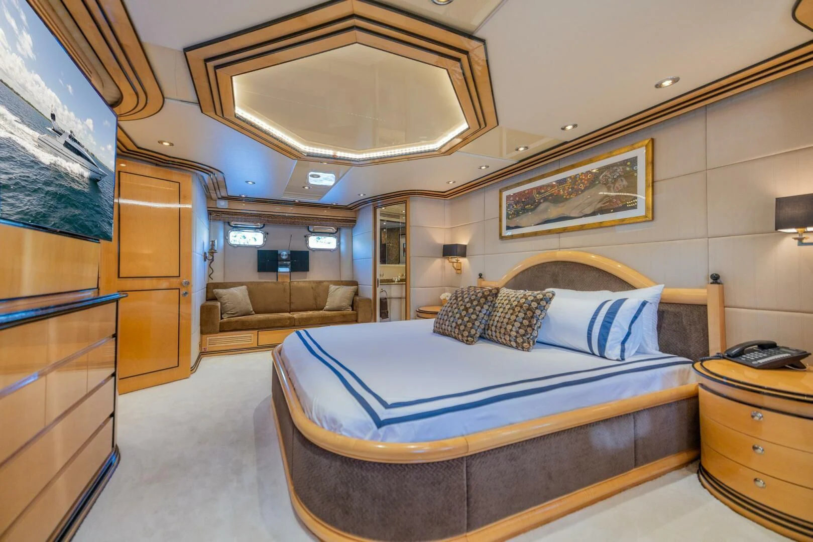a room with a bed and a desk aboard ENTOURAGE Yacht for Sale